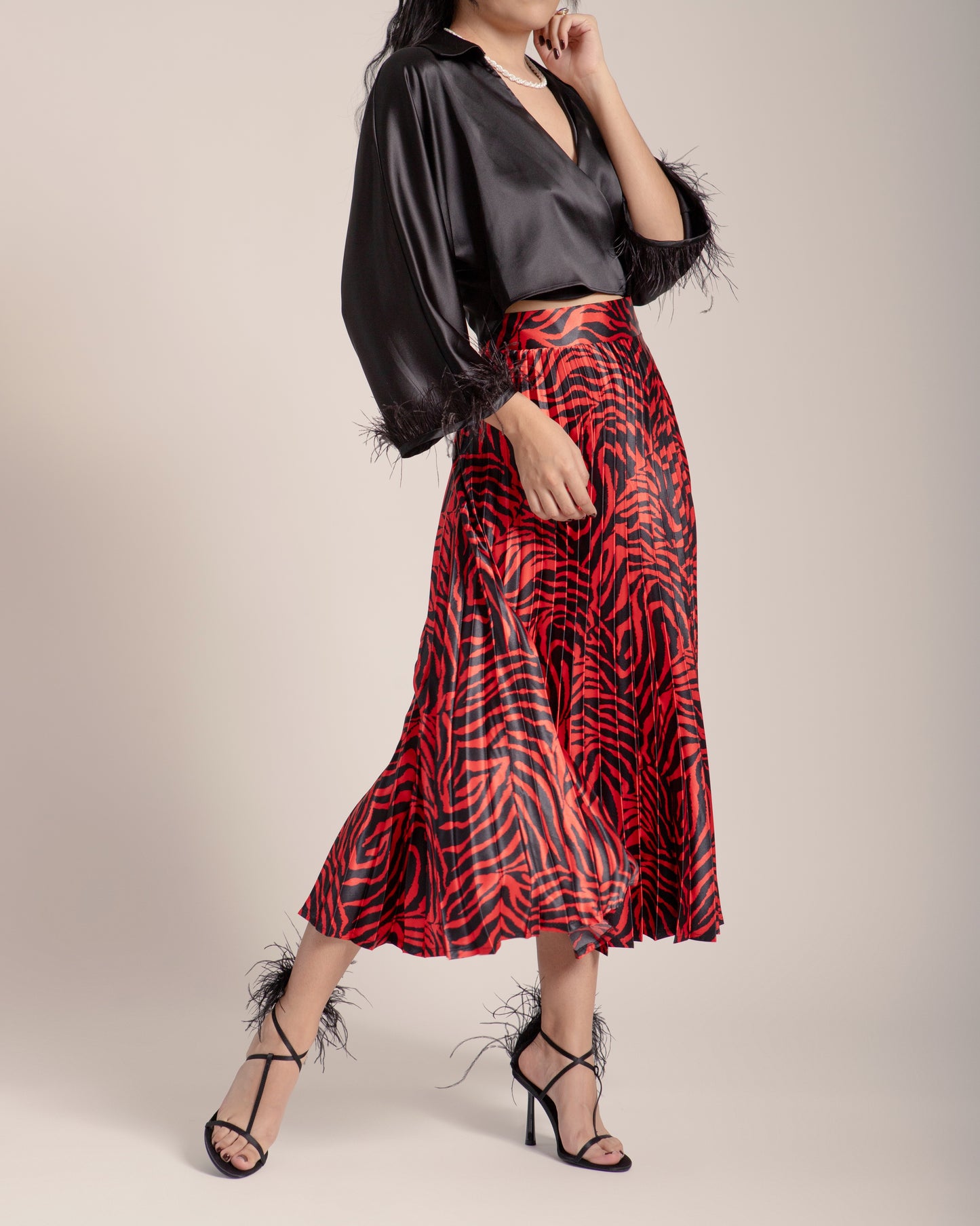 FALDA PLISADA ANIMAL PRINT ROJO
