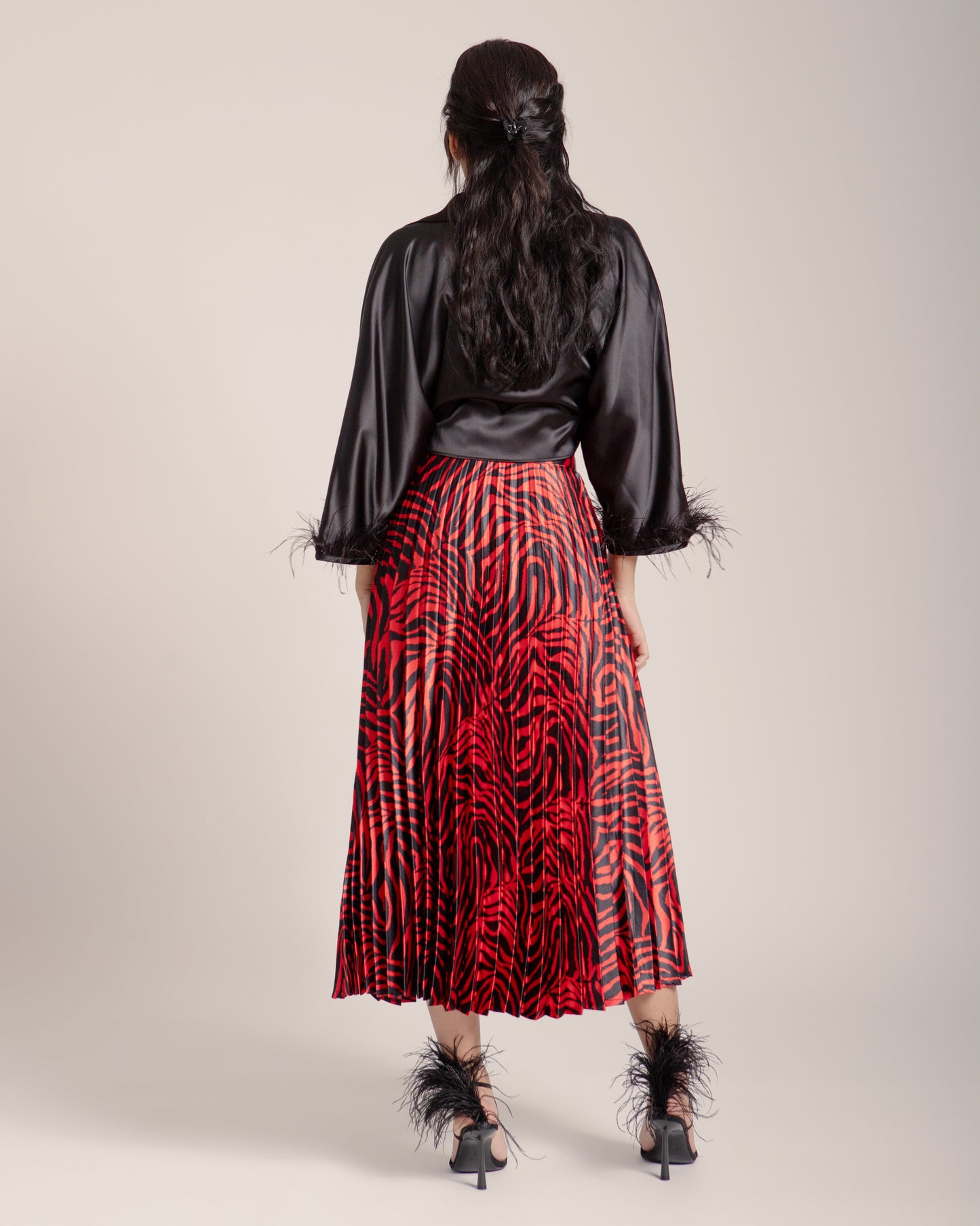 FALDA PLISADA ANIMAL PRINT ROJO